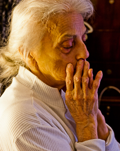 Elderly woman, despairing