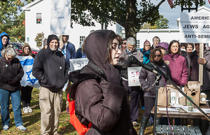 Young woman, Tali Shorr, speaks to outdoor audience