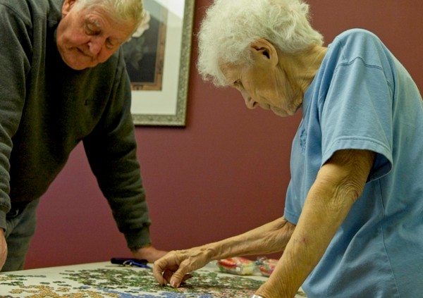 MAN AND WOMAN WITH PUZZLED