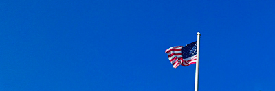 American flag against blue sky