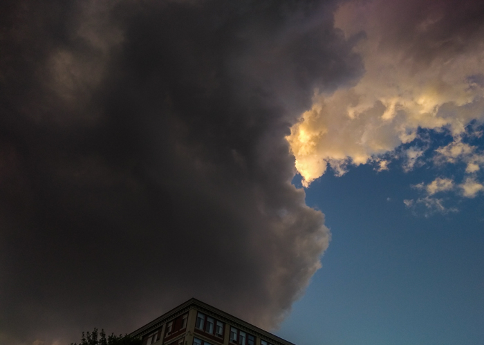 Storm clouds loom over apartment building