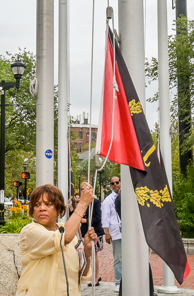 Doreen Wade holds halyard and prepares to lead flag raising