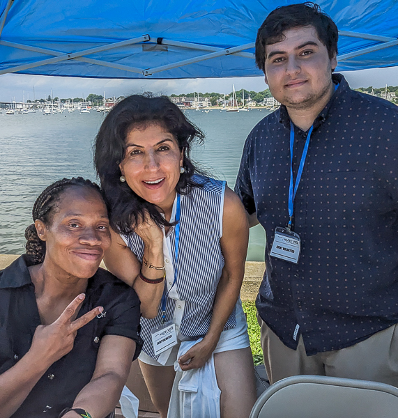 Three people staffing Salem United booth