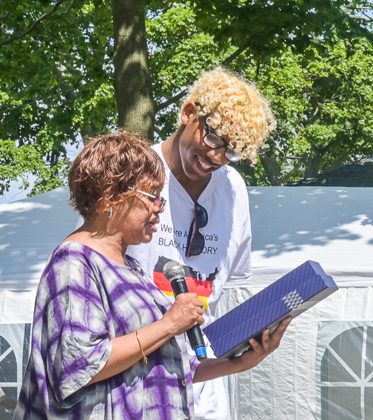 Doreen Wade presents gift to Mike