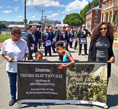 Su Almeida, her grandchildren, and Naliyah Wade lead the parade, followed by Essex Lodge Ancient Free & Accepted Masons 9th District